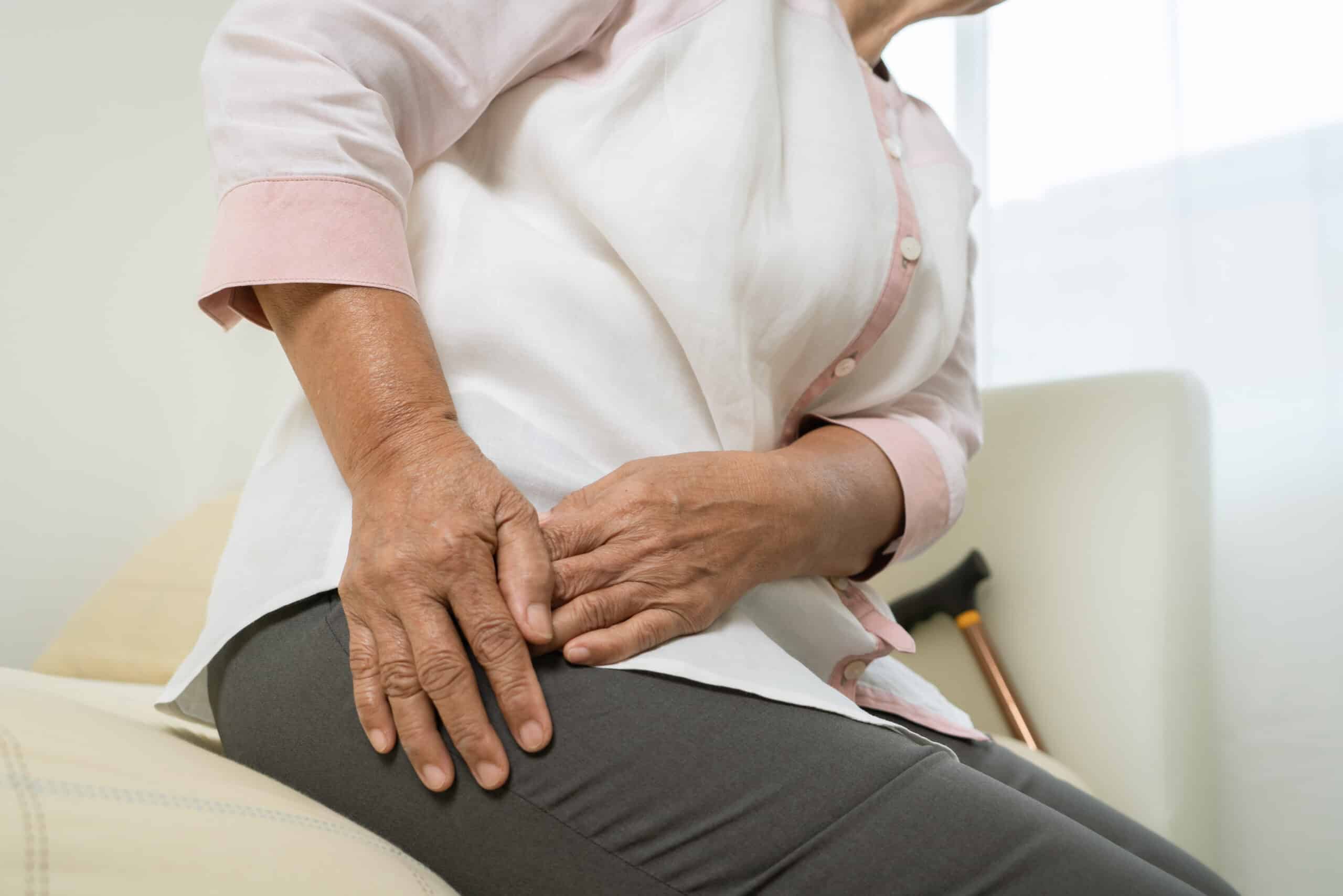 Hip Pain Of Senior Woman At Home, Healthcare Problem Of Senior Concept